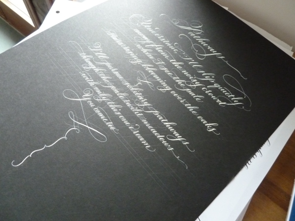 white-copperplate-on-black-paper