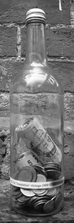 a-bottle-with-a-huge-wad-of-money-in-it-sterling