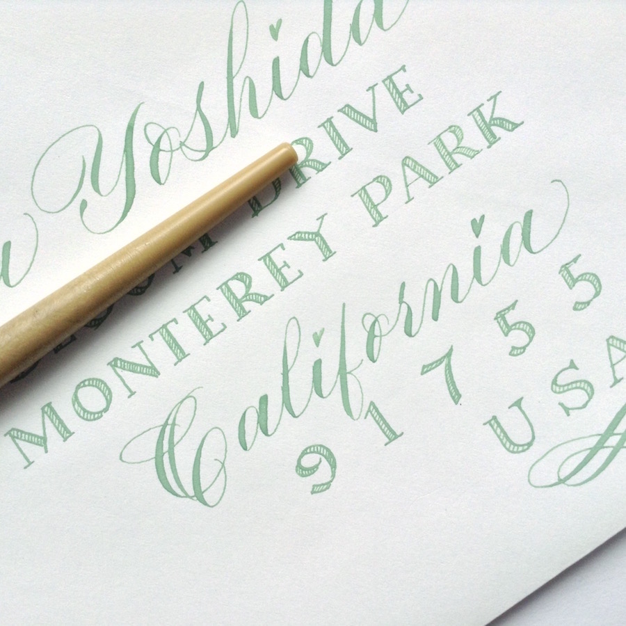 green-copperplate-alternative-envelope-address-with-modern-calligraphy-and-scroll-nib-capitals-for-blog-post-uk