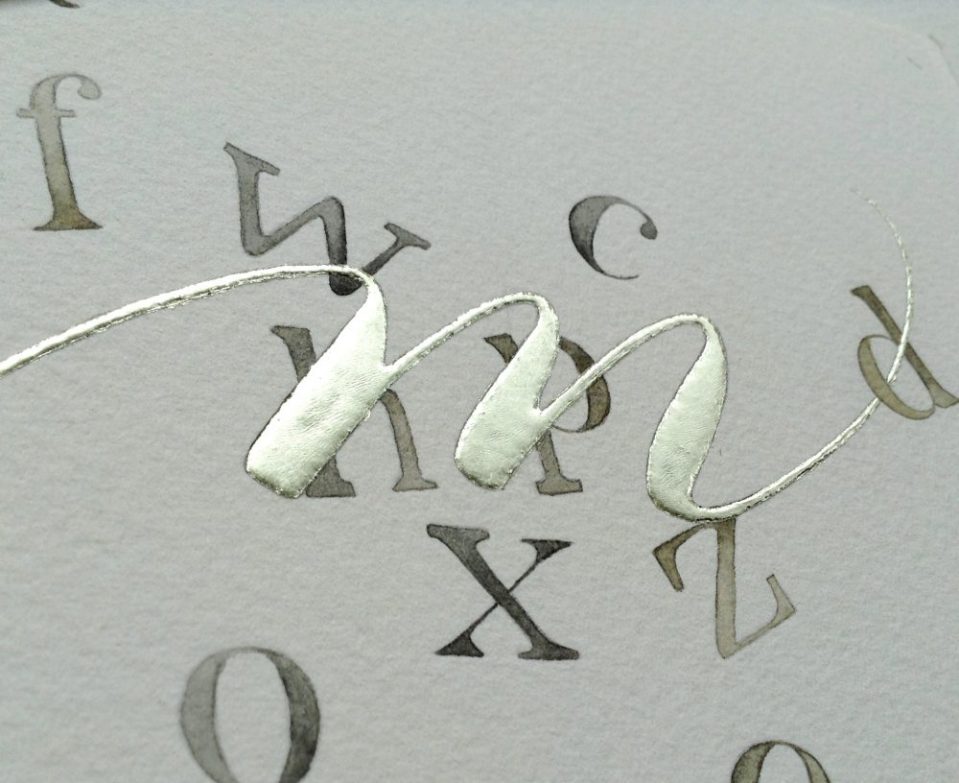 gold leaf on contemporary illuminated letter m