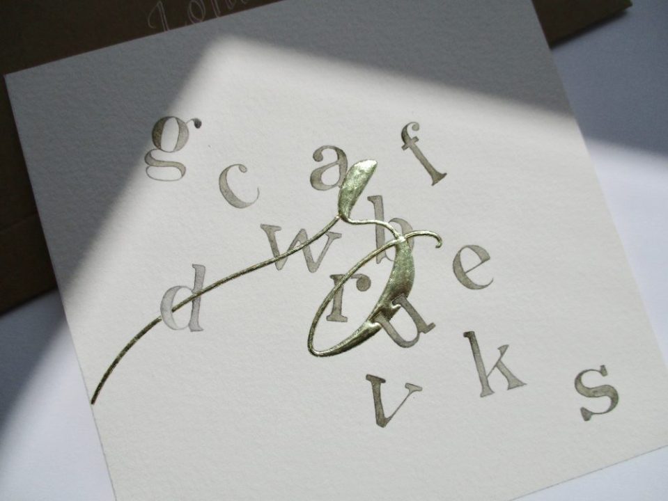 gilded calligraphy letter using real gold leaf