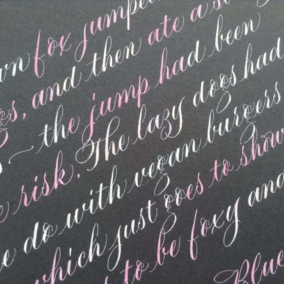 pink-and-white-copperplate-prose-on-grey-paper